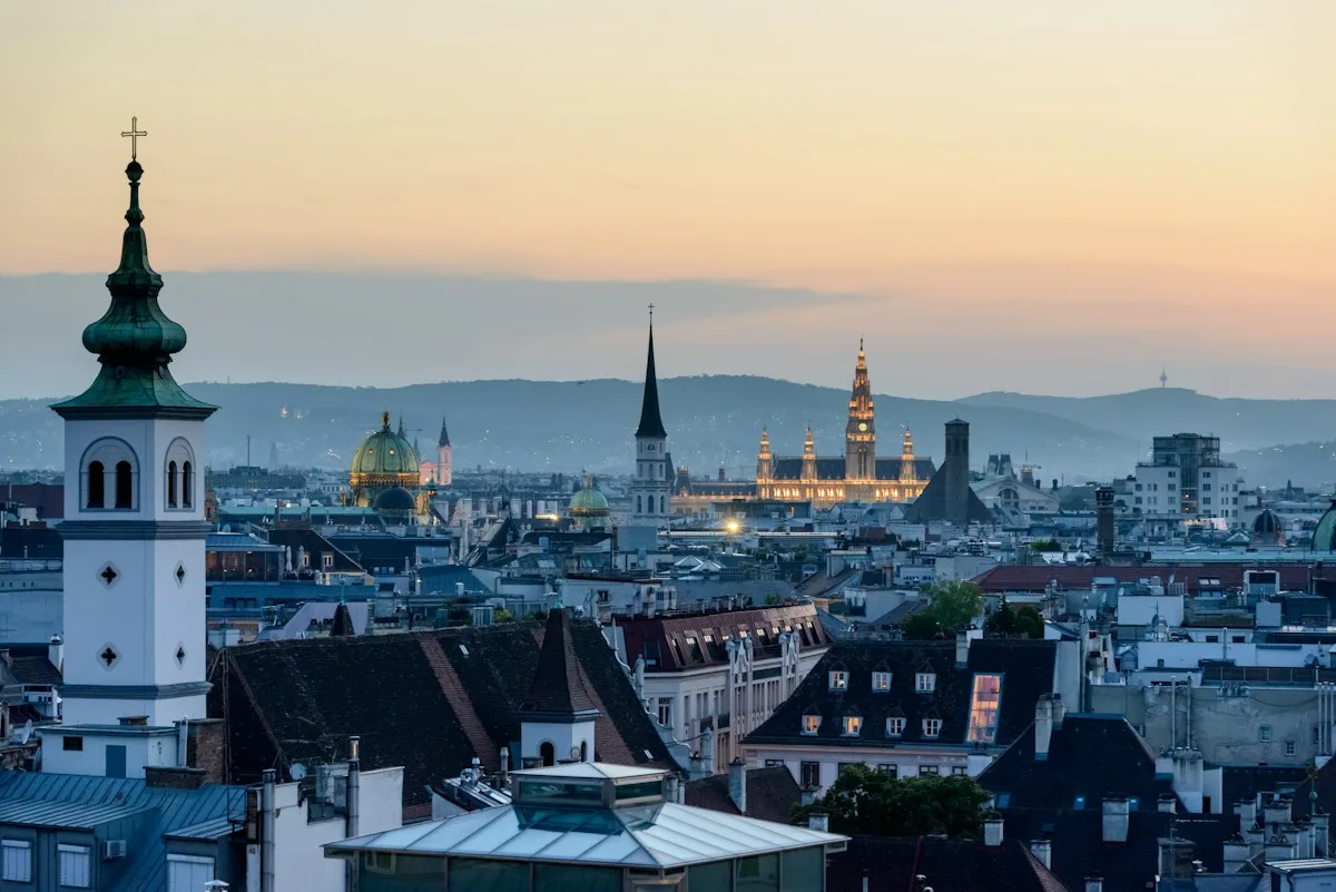Vienna rooftops and church towers at sunset