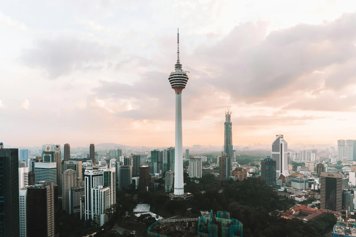 Kuala Lumpur Tower above the city at sunset